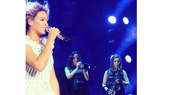 Adison Evans (far right) on stage with Beyoncé and Crystal Torres on the trumpet.