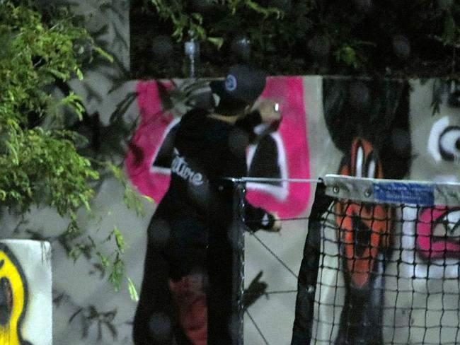 Justin Bieber spraypaints a Pacman ghost on the Gold Coast's QT Hotel in the early hours of Wednesday morning. P...