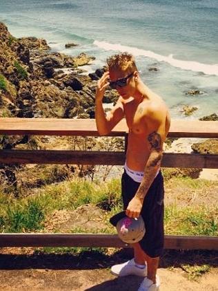 Justin Bieber goes shirtless on the Gold Coast in another Instagram post.