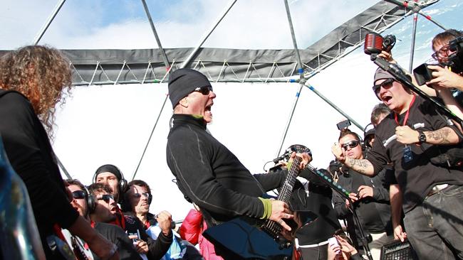 US heavy metal band Metallica's lead vocalist, James Hetfield (C), and lead guitarist Kirck Hammet (L) perform in Antarctica ...