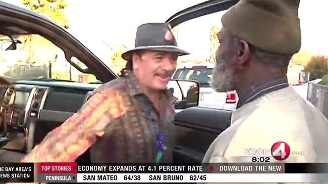 Santana greets his former bandmate Marcus Malone.