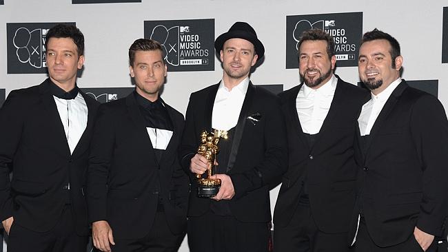 Lance Bass (second from left) with his N'Sync band mates at the MTV Video Music Awards in 2013. Picture: Ge...