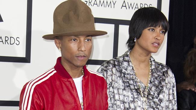 Pharrell Williams hit the red carpet with wife Helen Lasichanh sporting this ridiculous hat. And somehow, he pulled it off. P...