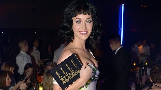 Katy Perry poses with her ELLE Woman of the Year award. Picture: AP