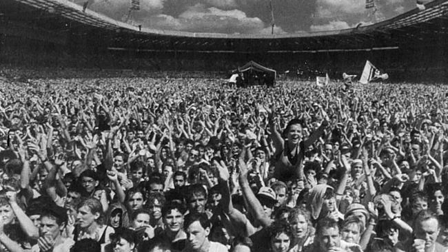 The crowd at the Live Aid charity fundraiser concert at Wembley Stadium 1985.