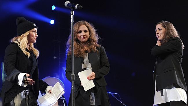 Speaking up...Madonna introduces Pussy riot rockers Maria Alyokhina (C) and Nadezhda Tolokonnikova onstage at the Amnesty Int...
