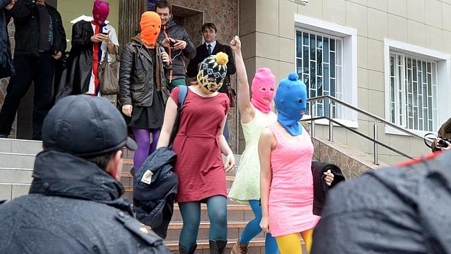 Free again ... Wearing mask members of Russian punk group Pussy Riot, Nadezhda Tolokonnik
