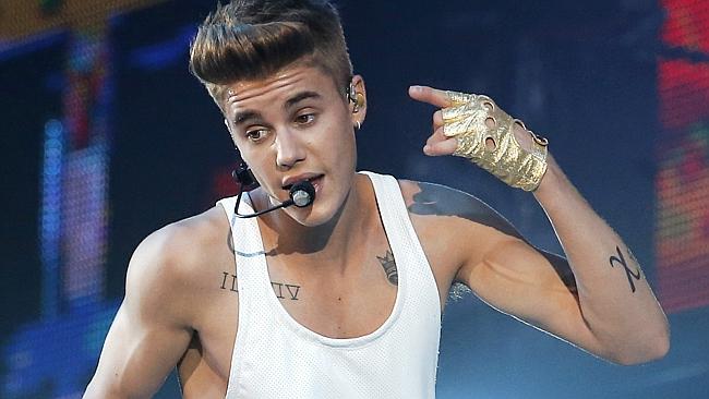 Justin Bieber performs during a concert at Bercy Arena in Paris. (AP Photo/Francois Mori,