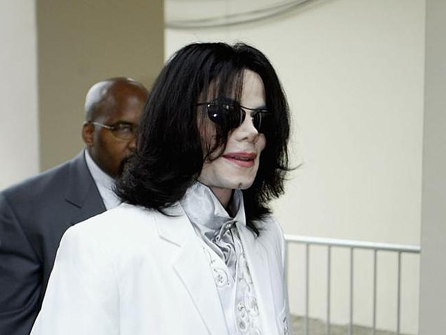 Media focus ... Michael Jackson before a 2004 court appearance in California.