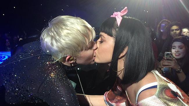 Katy Perry kisses Miley Cyrus during the Bangerz Tour on February 22. Picture: MAXA /Land