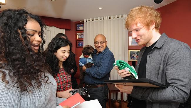 Making dreams come true ... Ed Sheeran performs in the home of fan Shiralee Dennis. Pictu