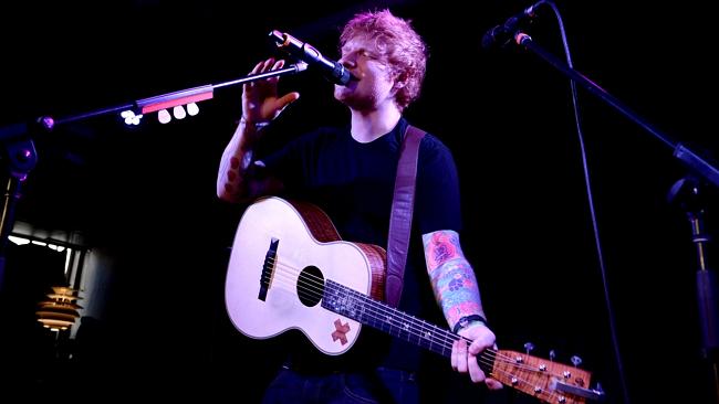 Sweaty ... Singer Ed Sheeran plays a gig for 200 people in Melbourne”s Ding Dong bar.