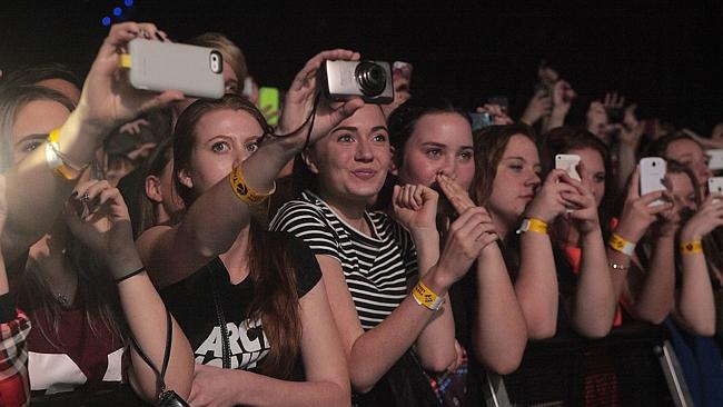 Fans watch British indie rock band Arctic Monkeys perform at Perth Arena. Picture: Bohdan