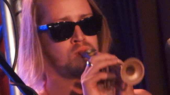 Macaulay Culkin plays a kazoo during a performance in Brooklyn, New York.