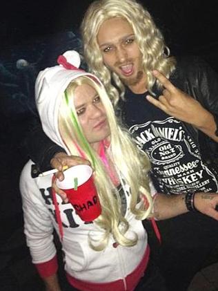 Deryck Whibley and Ari Cooper dress up as Avril Lavigne and Chad Kroeger for Halloween.