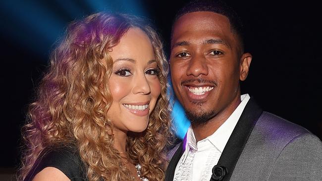 In her face ... Carey and husband, TV host Nick Cannon. Picture: Christopher Polk