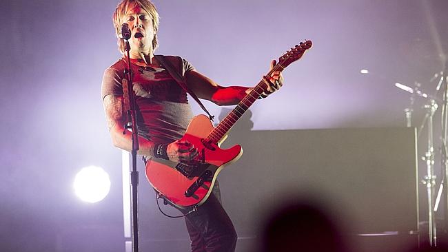 Keith Urban told the audience at Rod Laver Arena how he wrote the song a day after talkin