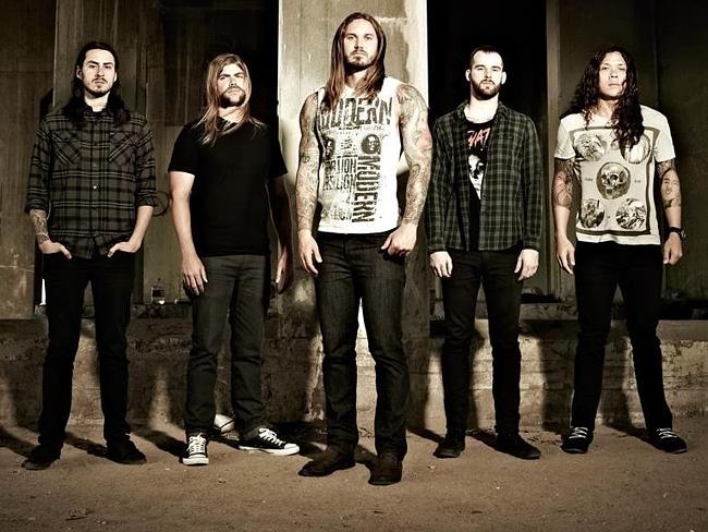 As I Lay Dying ... Lambesis, centre, with his band mates. Many Christian rockers are athe