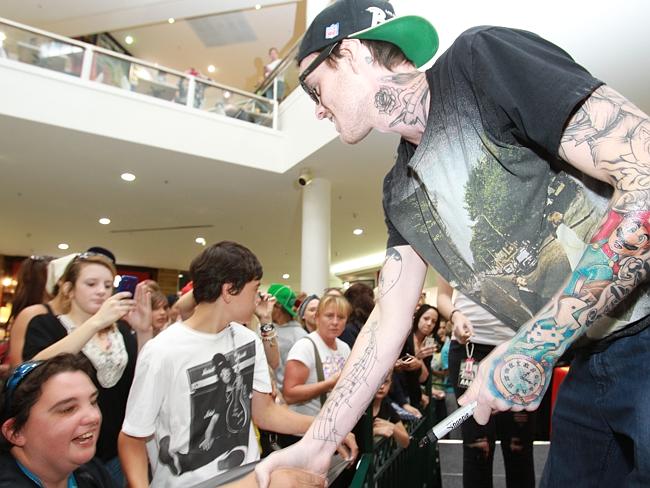 The rapper meets fans and signs autographs in Geelong in 2012.