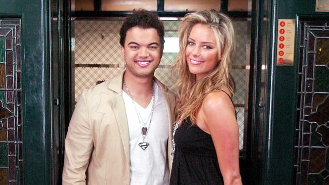 Singer Guy Sebastian shares some Elevator Love with former Miss Universe Jennifer Hawkins