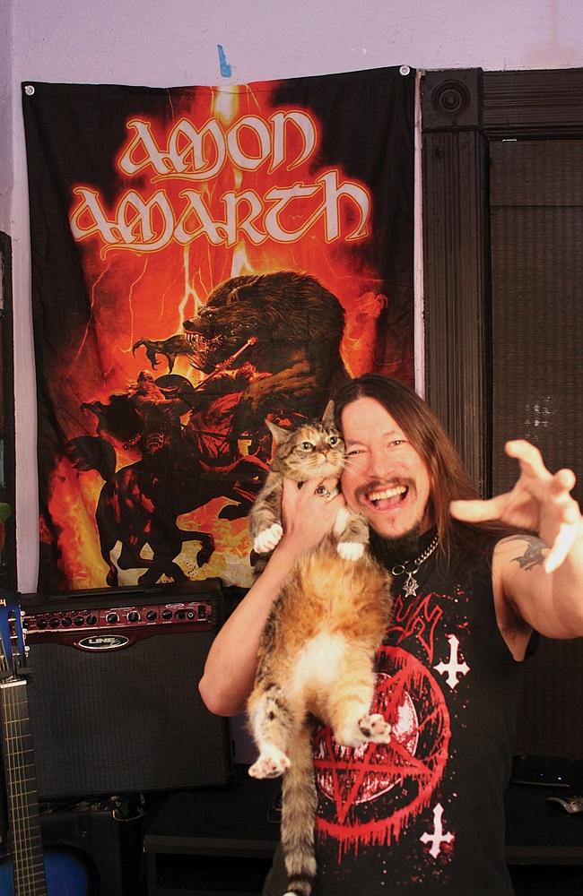 Epic cat-love ... Eddie Pederson and Squirrel of band, Thou Shall Kill. Picture: Alexandr