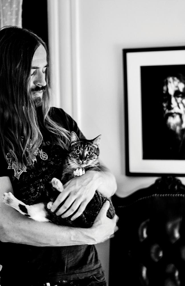 A touching moment ... Brett Hanson of band Evil Slime with cat Abigail. Picture: Alexandr