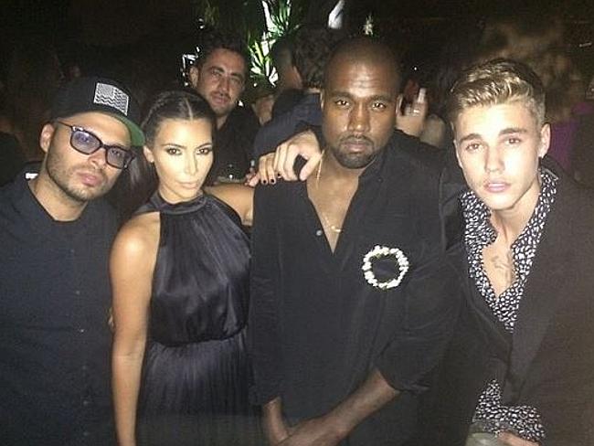 New songs ... West with Kardashian and Justin Bieber in Ibiza earlier this month. Picture