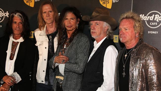 Health scare ... Aerosmith drummer Joey Farmer, right, has been rushed to hospital and wi