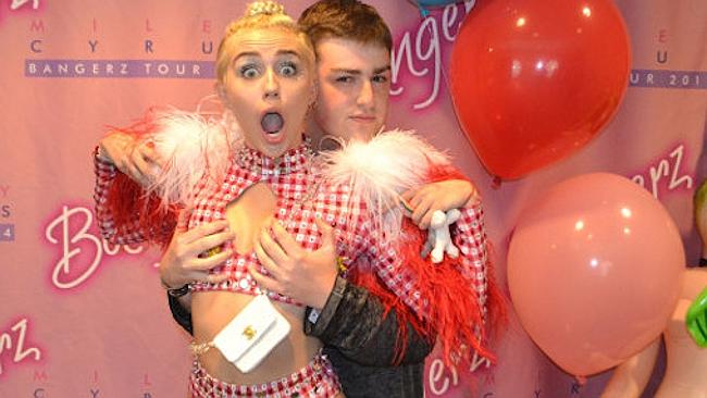 A Miley Cyrus fan gets a handful.