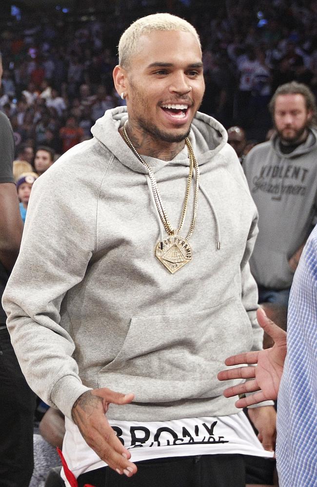 Unscathed ... Singer Chris Brown, pictured at the basketball in New York last week, was h