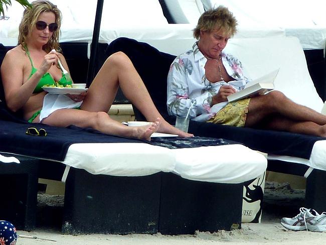 Back in Australia next year ... Penny Lancaster and Rod Stewart with family poolside at P