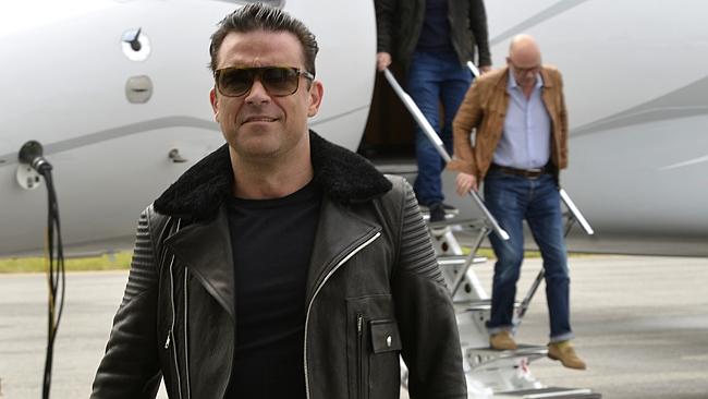 Robbie Williams arrives in Perth on private jet from Sydney. Picture: Theo Fakos