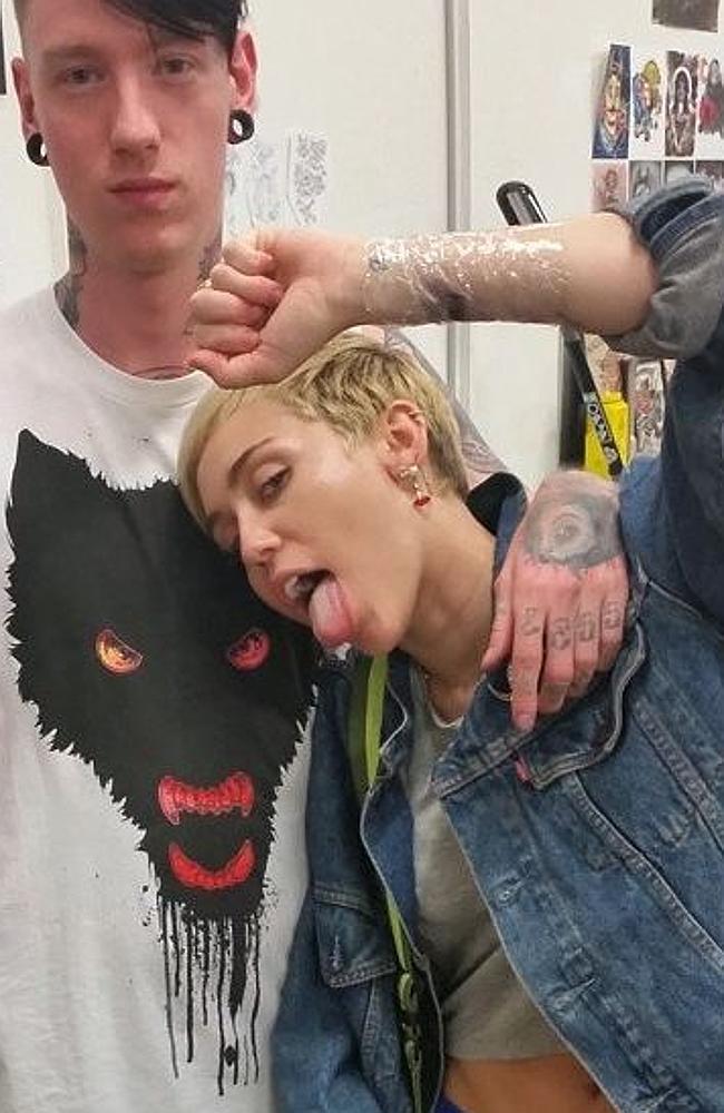 Caption: Miley Cyrus getting tattoo in Melbourne. Instagram