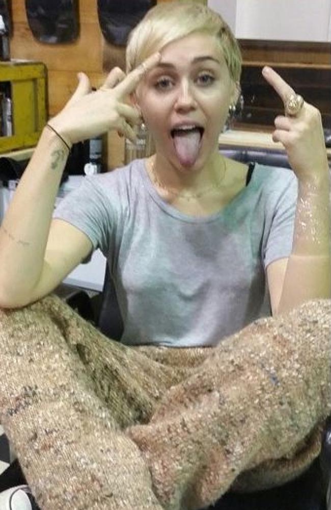 Miley hits Melbourne and gets a tattoo over beers