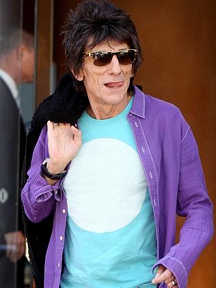 All mapped out ... Ronnie Wood leaves the Intercontinental Hotel in Adelaide. Picture: Ca