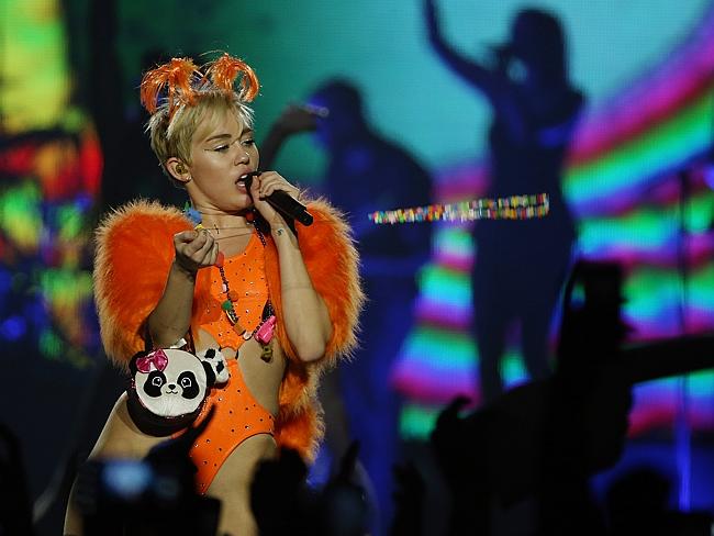 Bright lights ... Miley Cyrus on stage in Auckland. Picture: Getty