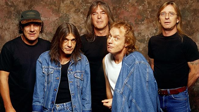 Phil Rudd (right) with other members of AC/DC (from left) lead singer Brian Johnson, Malc