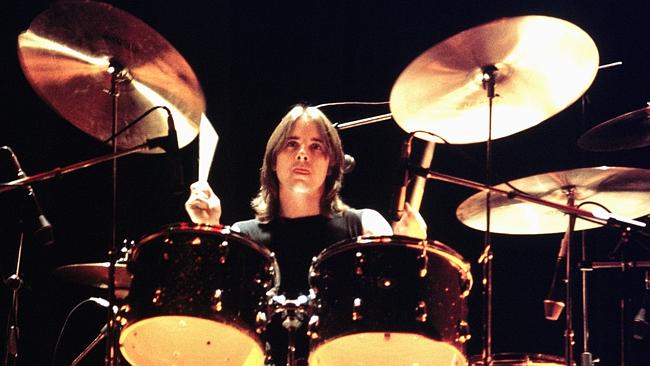 Phil Rudd mans the drum kit for AC/DC in a Hollywood concert in 1977. Pic: Getty Images