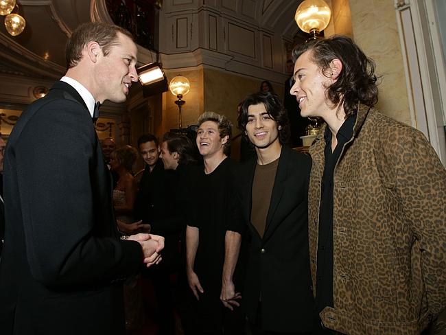 Royal touch...Prince William greets 1D after the Royal Variety Performance in London last