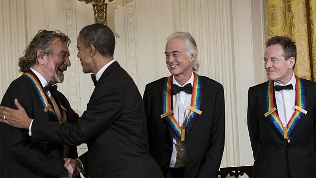 Barack Obama greets Led Zeppelin’s Robert Plant (L), Jimmy Page (2R) and John Paul Jones 