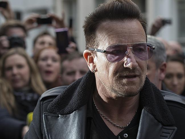 Naturally, Bono was there ... U2 frontman Bono arrives at a west London studio to record 