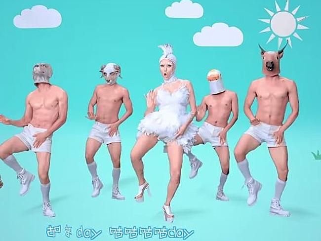 Scary topless dancers in shorts, socks and animal masks.