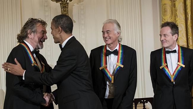 US President Barack Obama greets Led Zeppelin band members after an event in the East Roo