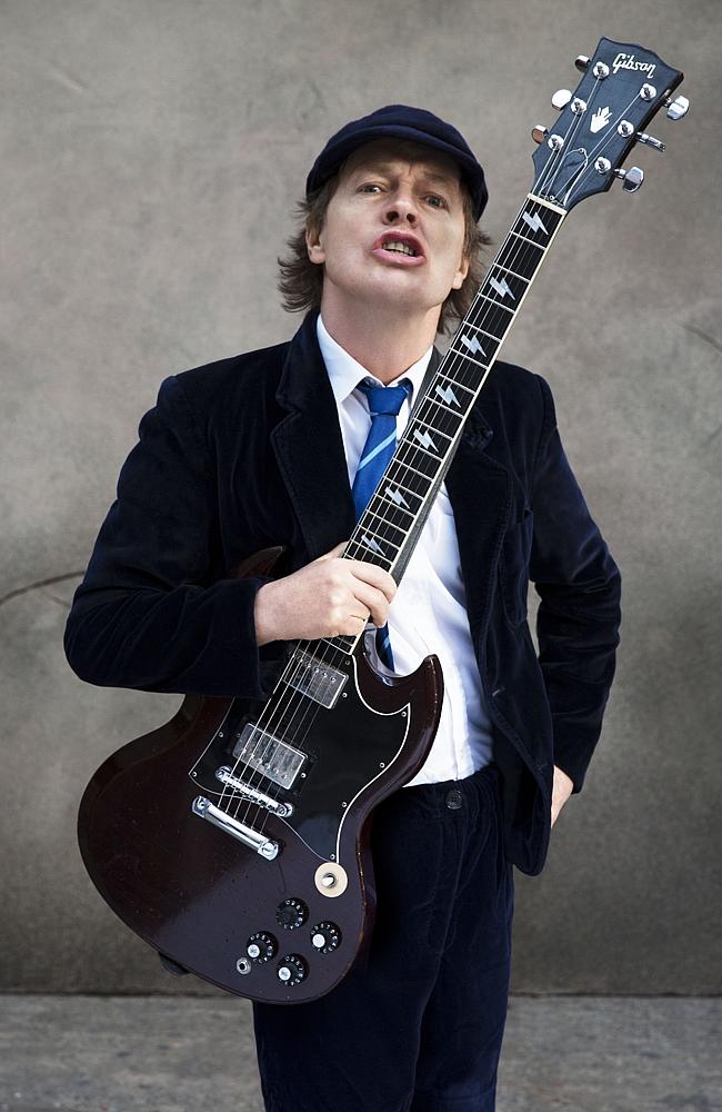 Still young ... Sporting his trademark school uniform, Angus Young honoured his brother’s