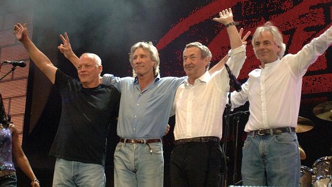 Pink Floyd: (L-R) David Gilmour, Roger Waters, Nick Mason and Rick Wright, salute an audi