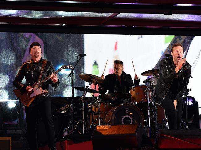 Rocking out ... Coldplay’s Chris Martin (right) performs with U2 during the World AIDS Da