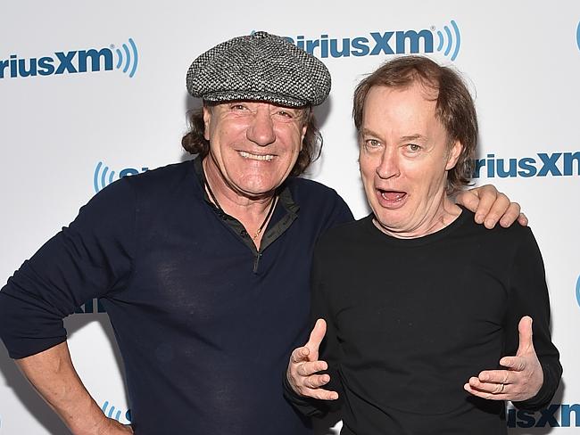 Concern ... Guitarist Angus Young, right, with singer Brian Johnson. Picture: Mike Coppol