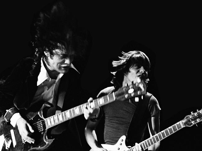 Brothers ... Angus and Malcolm Young on stage at Royal Oak Theater, Michigan, in 1978. Pi