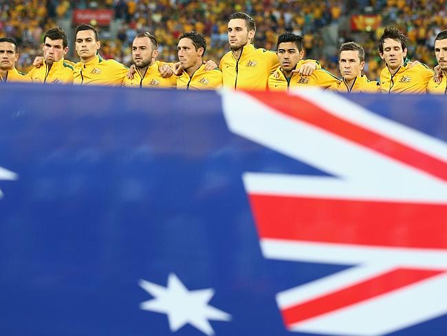 The Australian team sing the national anthem during the 2015 Asian Cup match between Oman