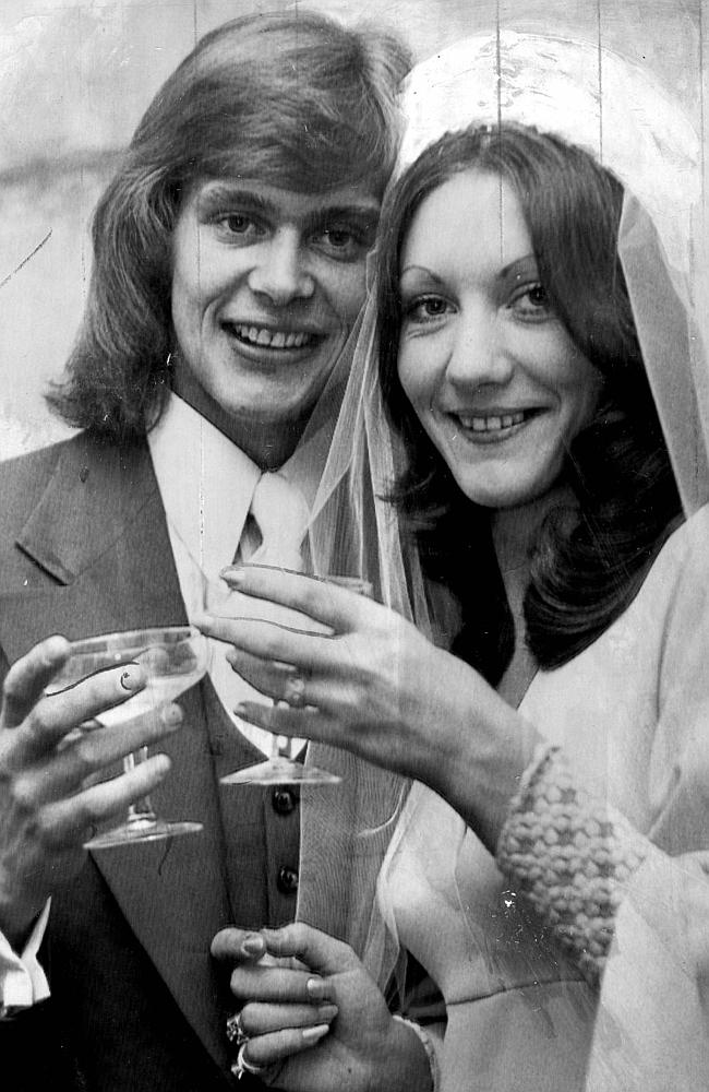 John Farnham and new bride share a drink at their wedding reception.
